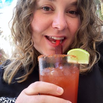 El Patio - A happy woman due to this delicious michelada - Bars Near Me - Berkeley, California