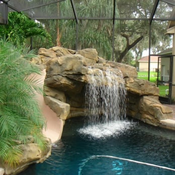 Caribbean Pools - a pool with a waterfall - General Contractors Near Me - Lakeland, Florida