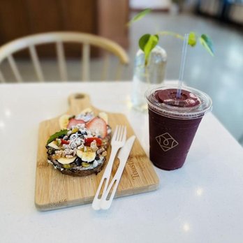 Toastique - a sandwich and a drink on a table - Juice Bars & Smoothies Near Me - Washington, DC, District of Columbia