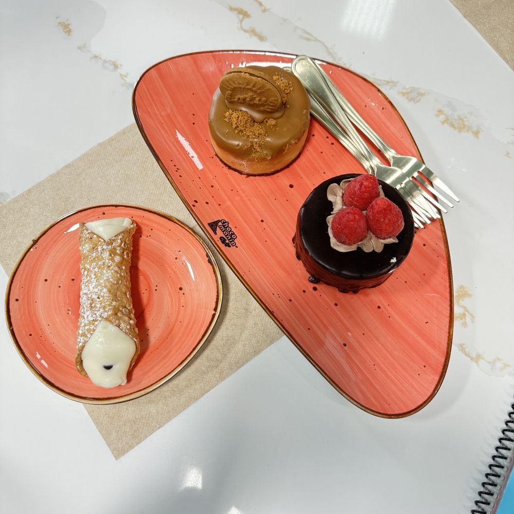 Cannoli, Biscoff Cheesecake, and Choco Rasberry Pastries Cannoli, Biscoff Cheesecake, and Choco Rasberry Pastries