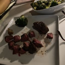 My youngest daughter got the petite filet. Excellent. Broccoli on the background. Also tasty