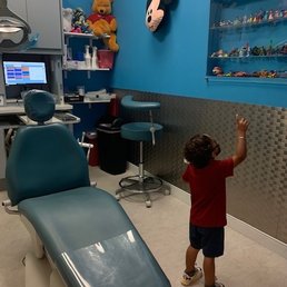 Private room at Kingstown Pediatric Dentistry - Fun toy collection and Disney murals on the walls.