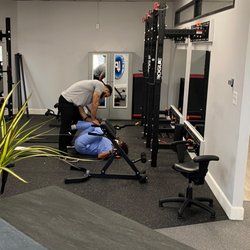 Life Performance Chiropractic - Helping to stretch tight hips and low back