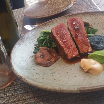 Husk - The beef ... incredibly small and quite $$$ ... that cheer wine you see is $4 - Southern Near Me - Nashville, Tennessee Husk - The beef ... incredibly small and quite $$$ ... that cheer wine you see is $4 - Southern Near Me - Nashville, Tennessee