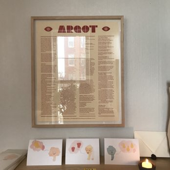 Angels Ate Lemons - a table with cards and a lit candle - Beer, Wine & Spirits Near Me - Baltimore, Maryland