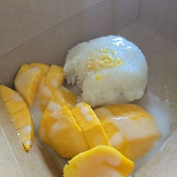 Lacha Somtum - Mango sticky rice (with a bite already eaten ) - Thai Near Me - Los Angeles, California