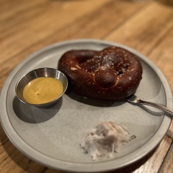 Salt's Cure - a pretzel and mustard on a plate - Breakfast & Brunch Near Me - Los Angeles, California Salt's Cure - a pretzel and mustard on a plate - Breakfast & Brunch Near Me - Los Angeles, California