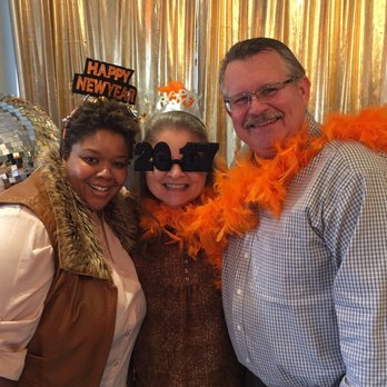 Mango Mangeaux - One of the owners, Lakesha, taking a fun New Years Day pic with me and my husband (I threw my orange feathered boa around his neck)!! - New American Near Me - Hampton, Virginia