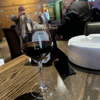 Robusto's Cigar Bar and Bistro - A glass of wine while being surrounded by burly men. - American Near Me - Sterling Heights, Michigan Robusto's Cigar Bar and Bistro - A glass of wine while being surrounded by burly men. - American Near Me - Sterling Heights, Michigan