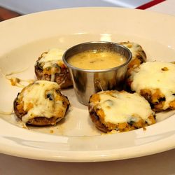 Tony And Luigis - Stuffed mushroom appetizer with dipping sauce