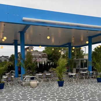 Mediterrano By Santorini - Outdoor seating with the addition of arborvitae adds some privacy from the road. - Mediterranean Near Me - West Cape May, New Jersey Mediterrano By Santorini - Outdoor seating with the addition of arborvitae adds some privacy from the road. - Mediterranean Near Me - West Cape May, New Jersey