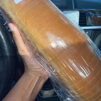 La Baguette Shop - a person holding a loaf of bread - Patisserie/Cake Shop Near Me - Brooklyn, New York La Baguette Shop - a person holding a loaf of bread - Patisserie/Cake Shop Near Me - Brooklyn, New York
