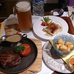Room service. Argentinian rump steak, patatas bravas, a pancake with dolche du leche and a Staropramen beer - heaven