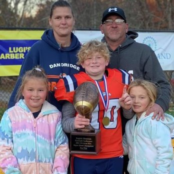 Walgreens - a family posing with a trophy - Drugstores Near Me - Bridgeton, New Jersey