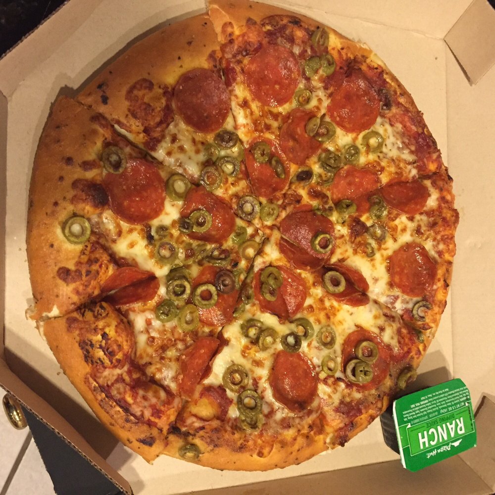 a pepperoni and olive pizza in a box a pepperoni and olive pizza in a box
