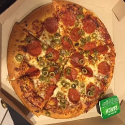 a pepperoni and olive pizza in a box a pepperoni and olive pizza in a box