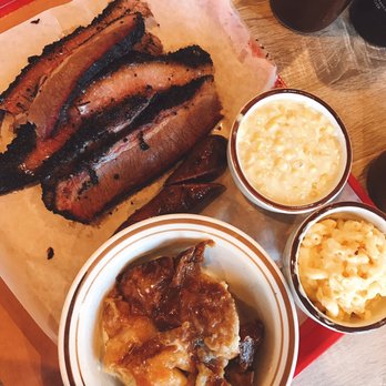 Killen's Barbecue - The spread: one pound of brisket, one jalapeño sausage, bread pudding, mac and cheese, creamed corn - Barbeque Near Me - Pearland, Texas