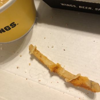 Buffalo Wild Wings - The hair cooked into my microwaved cheese fries. - Chicken Wings Near Me - West Allis, Wisconsin Buffalo Wild Wings - The hair cooked into my microwaved cheese fries. - Chicken Wings Near Me - West Allis, Wisconsin