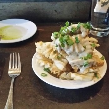 Trio American Bistro - Waffle fries with blue cheese sauce drizzled - New American Near Me - Jackson, Wyoming