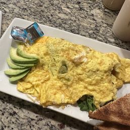 Omelet with sausage and mixed greens