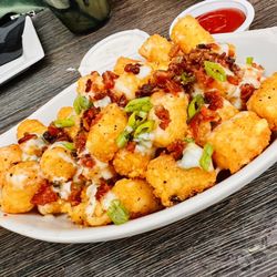 Tom's Watch Bar - House Garlic loaded tater tots.