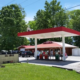 a gas station with a red roof
