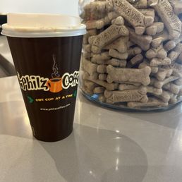 Ginger snap with decaf beside dog treats