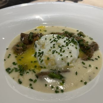 Bascook - Basque specialty - poached egg on a bed of sheep's milk cheese, with chanterelle mushrooms. - Signature Cuisine Near Me - Bilbao, BI