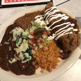 Chuy's - #4 Relleno & Enchilada - Beef Relleno in TexMex Sauce + Veggie Enchilada with TexMex Sauce; Mexican Rice + Refried Beans - Tex-Mex Near Me - Jacksonville, Florida Chuy's - #4 Relleno & Enchilada - Beef Relleno in TexMex Sauce + Veggie Enchilada with TexMex Sauce; Mexican Rice + Refried Beans - Tex-Mex Near Me - Jacksonville, Florida