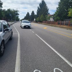 Surrey Metro Taxi - Concerned about this...  10 min  sitting cutting off traffic and bus. Informed dispatch  they quick to find if driver in distress.