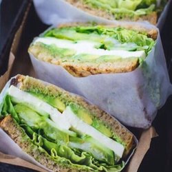 202 Mini Mart & Deli - Veggie Avocado Mozzarella and Lettuce on Whole Wheat Bread with an Olive Oil and Vinegar Drizzle