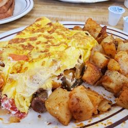 Pickle Barrel Delicatessen - Pickle Barrel Omelette with home fries and wheat toast