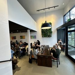 a group of people sitting at a table a group of people sitting at a table