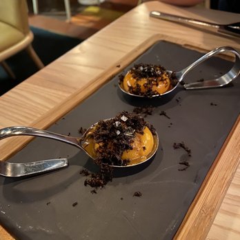 Madrina Bar y Tapas - Rich and dense in flavor egg yolks with shaved truffles - Tapas Bars Near Me - Toronto, Ontario Madrina Bar y Tapas - Rich and dense in flavor egg yolks with shaved truffles - Tapas Bars Near Me - Toronto, Ontario
