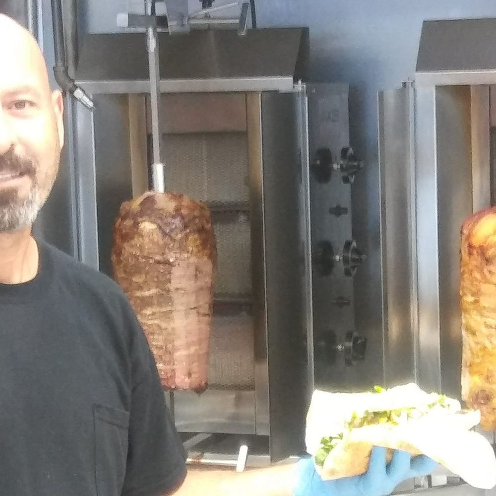 Shawarma Al Basha - Preparing a plate of the deliciously fresh shawarma. - Lebanese Near Me - Miami, Florida Shawarma Al Basha - Preparing a plate of the deliciously fresh shawarma. - Lebanese Near Me - Miami, Florida