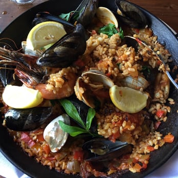 Barcelona Reston - Seafood paella. It looks nice but it's very FISHY! This is the portion we didn't finish. - Tapas/Small Plates Near Me - Reston, Virginia Barcelona Reston - Seafood paella. It looks nice but it's very FISHY! This is the portion we didn't finish. - Tapas/Small Plates Near Me - Reston, Virginia