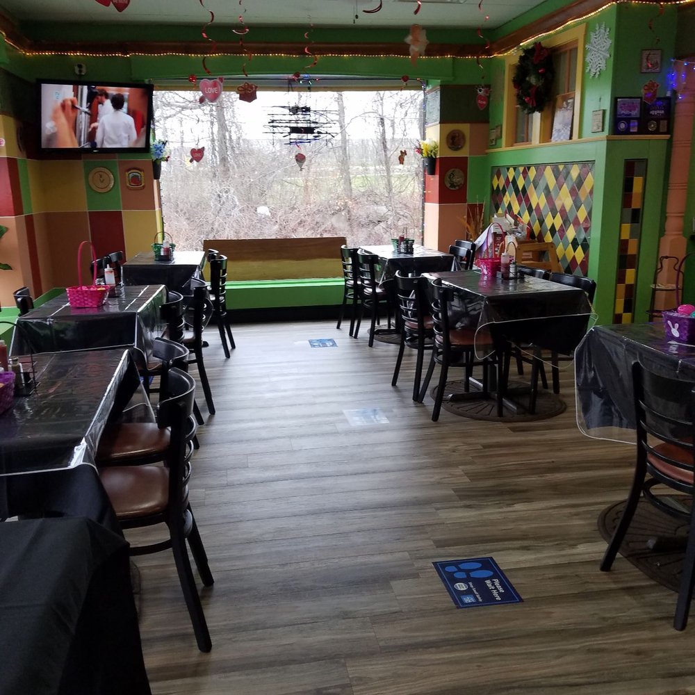 tables and chairs in a brightly decorated restaurant