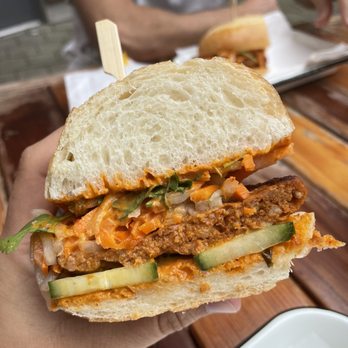 Better Half - a person holding a sandwich in their hand - Sandwiches Near Me - Portland, Oregon