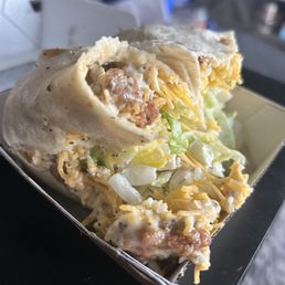 This wrap was supposed to be sweet bbq and they put garlic parm and it's ripped so bad I can't even pick it up. This place sucks.