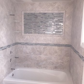 F&S Tile Installation - a bathtub and window - Tiling Near Me
