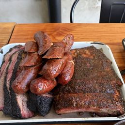 Pork ribs, beef and jalapeño cheddar sausage, brisket Pork ribs, beef and jalapeño cheddar sausage, brisket