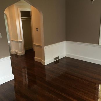 Bourne Flooring - an empty room with wood floors - Flooring Near Me