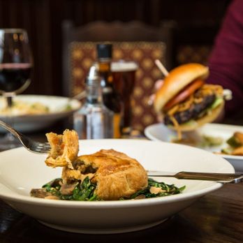 Fionn MacCool's - a plate of food and a glass of wine - Irish Pub Near Me - Toronto, Ontario Fionn MacCool's - a plate of food and a glass of wine - Irish Pub Near Me - Toronto, Ontario
