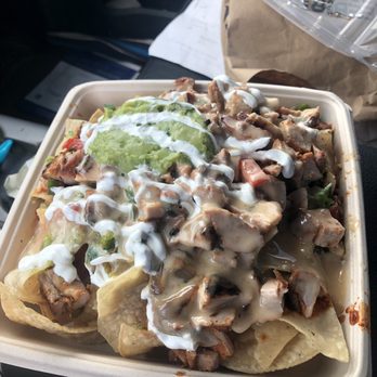 Freebirds World Burrito - Spicy chicken nachos with guacamole and sour cream - Mexican Near Me - Pearland, Texas