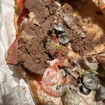 Subway - a slice of pizza with meat and vegetables - Sandwiches Near Me - Lynnwood, Washington Subway - a slice of pizza with meat and vegetables - Sandwiches Near Me - Lynnwood, Washington