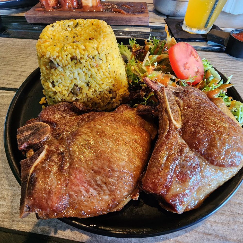 Raices Restaurant - OMG... could it be any better??? Pork chops, arroz con gandules and salad. - Caribbean Near Me - Worcester, Massachusetts
