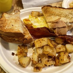 Crossroads Diner & Deli - Part of the long road breakfast. Scrambled eggs, bacon, homemade toast and home fries. Other portion was the French toast.
