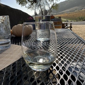 Schug Winery - a glass of wine on a table - Wineries Near Me - Sonoma, California