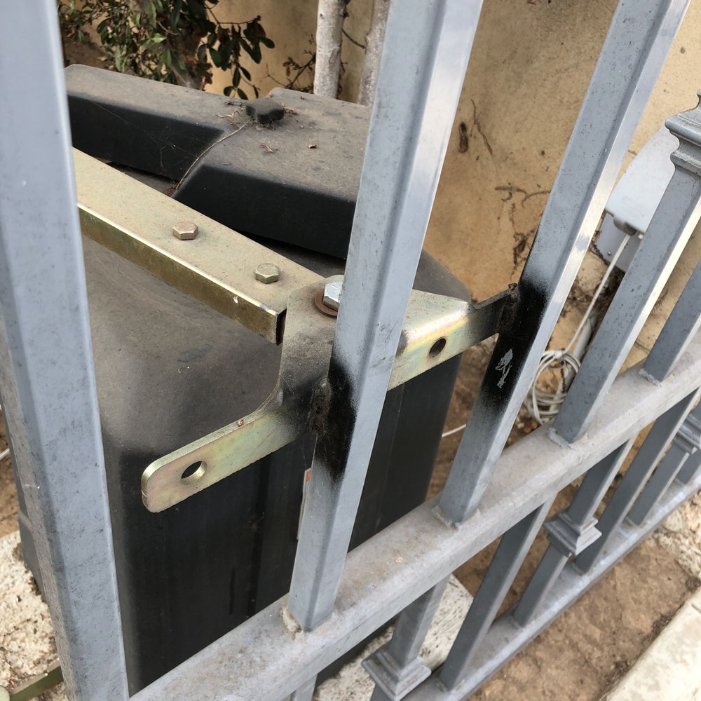 AAA Gate - Shoddy workmanship. Rattle can paint, didn't even try and match the paint color and left extra steel overhanging the bars. - Fences & Gates Near Me