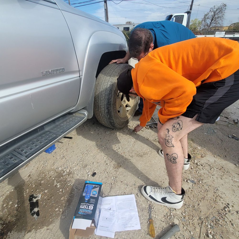 Walnut Hill Wrecker - Spare tire being installed Again, Epic - Towing Near Me - Dallas, Texas Walnut Hill Wrecker - Spare tire being installed Again, Epic - Towing Near Me - Dallas, Texas